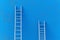 Leadership success concept ladder achievement on blue wall background