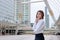 Leadership woman business concept. Portrait of confident young Asian businesswoman standing at urban building background.