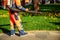 Leaf blower Male worker removes leaves lawn of garden autumn