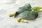 A leaf of ivy and pills on a light concrete table. Production of cough medicine  with ivy extract. pharmaceutical industry