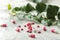 A leaf of ivy and pills on a light concrete table. Production of cough medicine with ivy extract. pharmaceutical industry