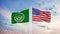 The League of Arab States and America are two flags on the flagpole and the blue sky