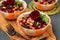 Lean chickpea and beetroot salad on a wooden board against a dark background, decorated with beetroot roses