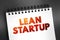 Lean Startup - method used to found a new company or introduce a new product on behalf of an existing company, text on notepad,