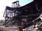 Leaning structure, partially demolished at asbestos and demolition debris cleanup site