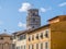 The Leaning Tower behind ancient buidlings in Pisa