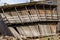 Leaning wooden shed in the process of destruction