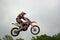 A leap over the hill motocross racer