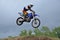 A leap over the hill motocross racer