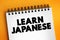 Learn Japanese text on notepad, concept background