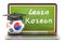 Learn Korean concept with laptop blackboard, graduation cap and