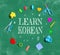 Learn Korean theme with school supplies on a chalkboard