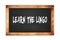 LEARN  THE  LINGO text written on wooden frame school blackboard