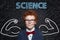 Learn Science.  Strong smart child student on blackboard background with formulas