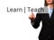 Learn Teach - Businesswoman hand pressing button on touch screen