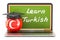 Learn Turkish concept with laptop blackboard, graduation cap