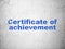 Learning concept: Certificate of Achievement on wall background