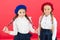 Learning french. happy children in uniform. friendship and sisterhood. best friends. little girls in french beret