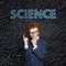 Learning science concept. Smart child on blackboard background with science formulas