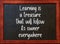 Learning is a treasure. Motivational quote on blackboard