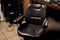 Leather adjustable chair in the barbershop