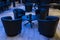 Leather arm chairs around round table in hotel, meeting place, bar table under bar club light