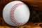 Leather baseball glove with ball, closeup. Sportive equipment