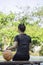 Leather basketball in hand of a woman wearing a watch Background blur tree in Bang Yai park , Nonthaburi , Thailand.May 24, 2019