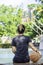 Leather basketball in hand of a woman wearing a watch Background blur tree in Bang Yai park , Nonthaburi , Thailand.May 24, 2019