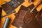 Leather and craft tools on table, top view
