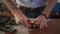 Leather craftsman works in his workshop. Master making leather products. Man carves leather sheet shape for die punch