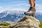 Leather hiking shoe of a man stepping on a rock in the Ziller Valley, Austria