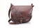 Leather hunting bag with brown ornament with patronage on white background