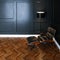 Leather lounge chair in new black interior with wooden parquet f