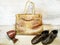 Leather products: bags, shoes, belts on a wooden textured background