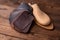 Leather samples for shoes and wooden shoe last on dark wooden table