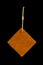 Leather shape sample tag on small chain, isolated on black