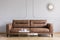 Leather sofa, coffee tables and mirror in a living room interior