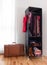 Leather suitcase and mobile wardrobe with clothing