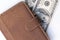 A leather wallet and dollars on white background close up as a symbol of wealth and financial prosperity, earning money and