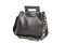 Leather women`s bag with a long handle, black bag, jewelry on the handle, on a white background, isolate