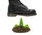 Leather work boot hanging over a miniature forest island made of soil and toy plastic trees