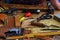 Leathercraft working tools on workshop desk