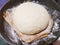 Leavened bread dough in tray with baking paper