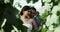 Leaves, bride and groom embrace at wedding in nature, love and commitment for couple at reception. Romance, woman and