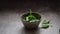 Leaves of fresh baby spinach falling into a Bowl