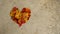 Leaves in a heart on concrete, background