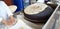 Lebanese Cuisine: Traditional Saj Flatbread being baked