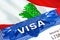 Lebanon Visa in passport. USA immigration Visa for Lebanon citizens focusing on word VISA. Travel Lebanon visa in national
