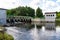 Lebien, Pomeranian Voivodeship / Poland - July 11, 2019: Small hydroelectric power plant in Central Europe. A dam on a small river